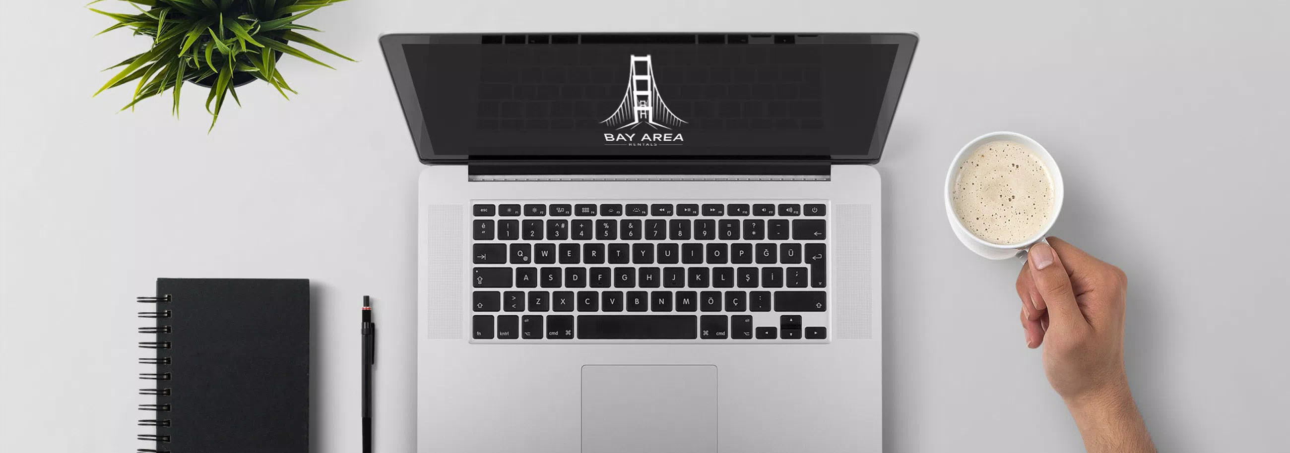 a laptop with Bay Area logo on the screen